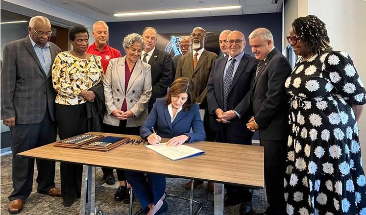 RWDSU President Stuart Appelbaum stands with New York Governor Hochul as she signs the Retail Worker Safety Act into Law at the New York City Central Labor Council in New York City on September 4, 2024. Photo credit: Retail, Wholesale and Department Store Union