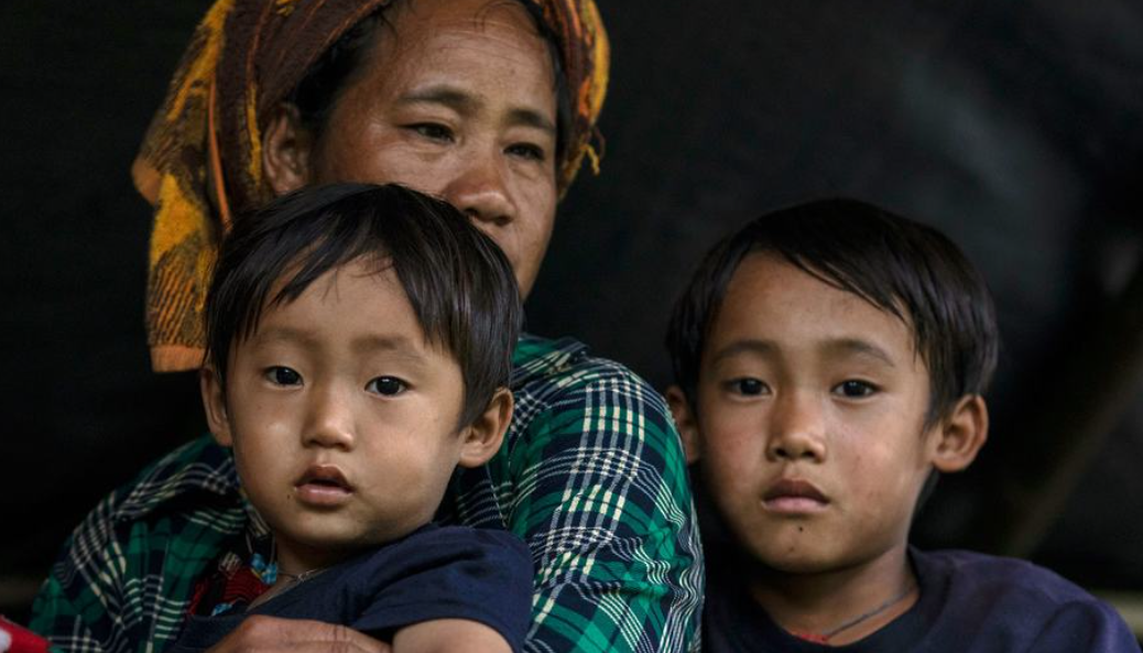 UNOCHA/Siegfried Modola A family arrives safely after fleeing the restive east of Myanmar.